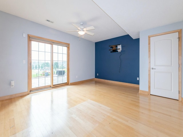 2705 147th St, Urbandale, IA 50323 - empty room featuring ceiling fan and light wood-type flooring