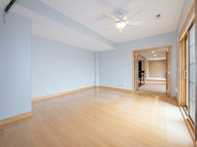 2705 147th St, Urbandale, IA 50323 - spare room with light wood finished floors and a ceiling fan