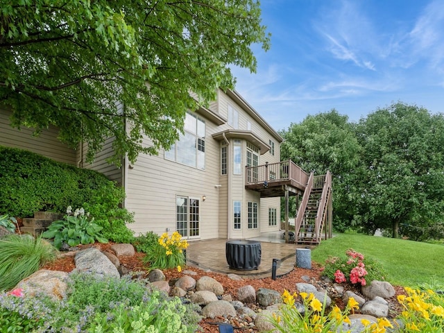 2705 147th St, Urbandale, IA 50323 - back of house featuring a patio area, a deck, stairway, and a yard