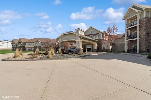 1370 SW Magazine Rd Unit 101, Ankeny, IA 50023 - craftsman inspired home featuring a residential view and curved driveway