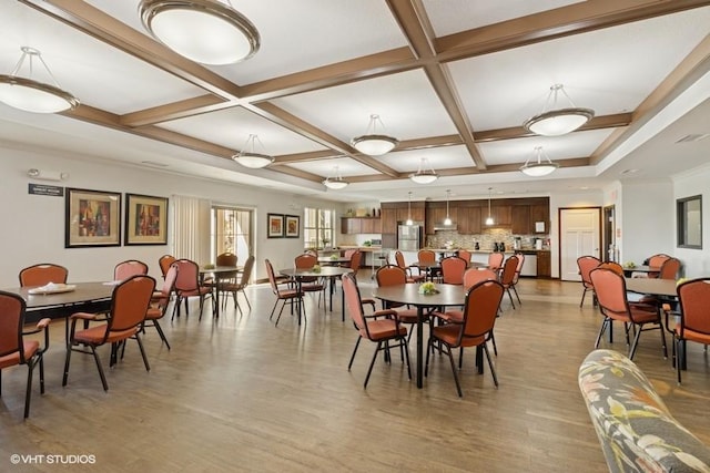 1370 SW Magazine Rd Unit 101, Ankeny, IA 50023 - dining space with light wood-style flooring, beam ceiling, and coffered ceiling