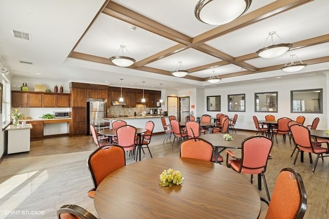 1370 SW Magazine Rd Unit 101, Ankeny, IA 50023 - dining room featuring light wood-style floors, beamed ceiling, coffered ceiling, ornamental molding, and visible vents
