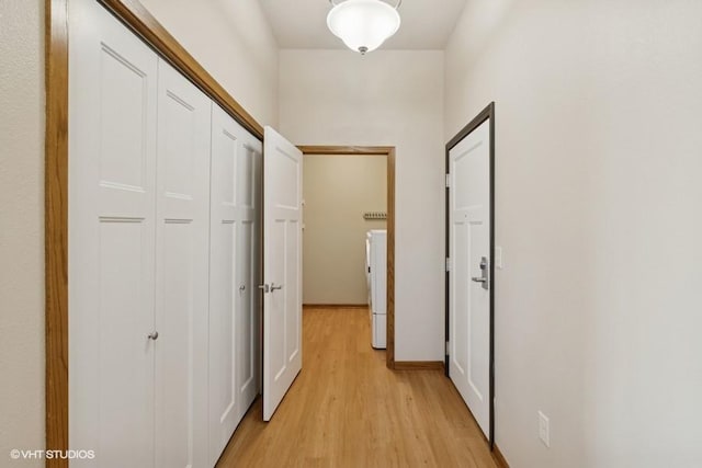 1370 SW Magazine Rd Unit 101, Ankeny, IA 50023 - hallway featuring light wood-type flooring and independent washer and dryer