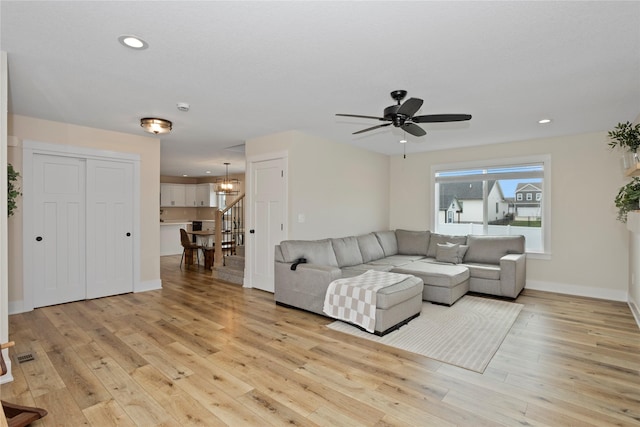 3121 NW 27th Cir, Ankeny, IA 50023 - living area featuring light wood-style flooring, a chandelier, ceiling fan, recessed lighting, and baseboards
