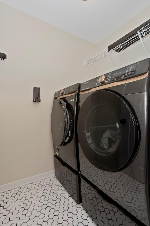 3121 NW 27th Cir, Ankeny, IA 50023 - washroom featuring independent washer and dryer and baseboards