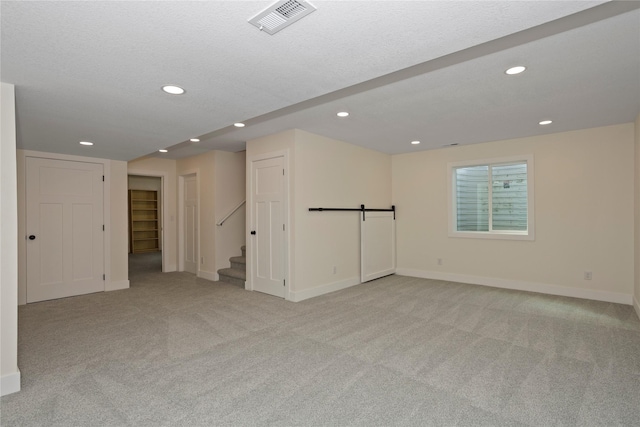 3121 NW 27th Cir, Ankeny, IA 50023 - unfurnished room featuring recessed lighting, light carpet, baseboards, and stairway