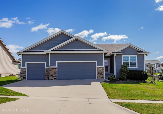 craftsman inspired home with a front lawn, stone siding, a garage, and concrete driveway