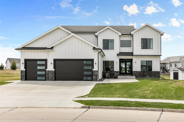 16318 Goldenrod Dr, Urbandale, IA 50323 - modern farmhouse style home with a front lawn, stone siding, a garage, and concrete driveway