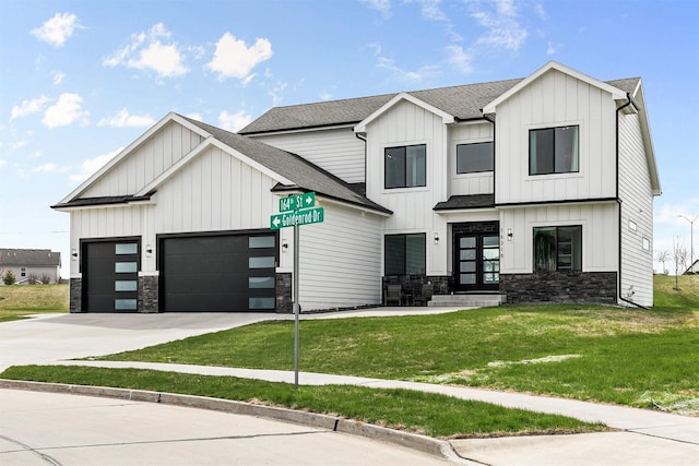 16318 Goldenrod Dr, Urbandale, IA 50323 - modern farmhouse with an attached garage, stone siding, board and batten siding, concrete driveway, and a front lawn