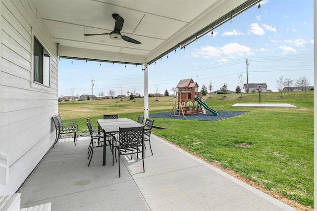 16318 Goldenrod Dr, Urbandale, IA 50323 - view of patio / terrace with outdoor dining space, ceiling fan, and a playground