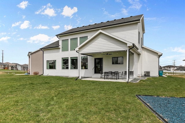 16318 Goldenrod Dr, Urbandale, IA 50323 - back of house featuring a lawn, ceiling fan, a patio area, and central AC