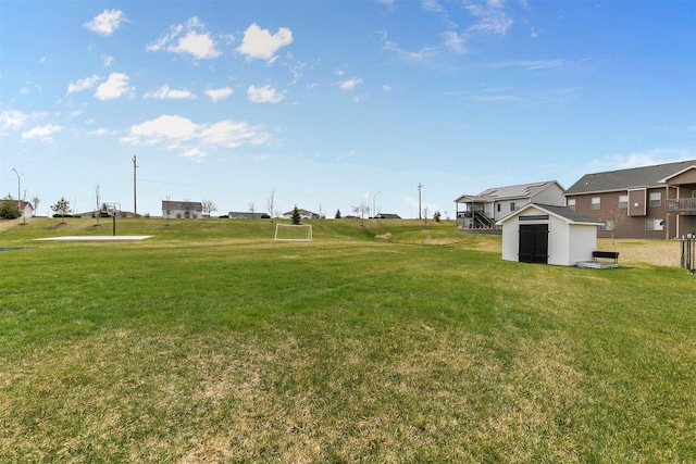 16318 Goldenrod Dr, Urbandale, IA 50323 - view of yard featuring a storage shed and an outbuilding