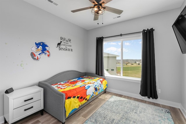 16318 Goldenrod Dr, Urbandale, IA 50323 - bedroom featuring visible vents, baseboards, and wood finished floors