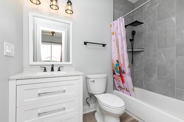 16318 Goldenrod Dr, Urbandale, IA 50323 - full bath featuring toilet, a ceiling fan, shower / tub combo with curtain, vanity, and wood finished floors