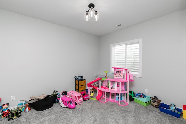16318 Goldenrod Dr, Urbandale, IA 50323 - rec room featuring visible vents and carpet