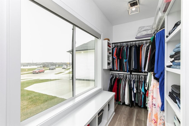 16318 Goldenrod Dr, Urbandale, IA 50323 - spacious closet featuring visible vents and wood finished floors