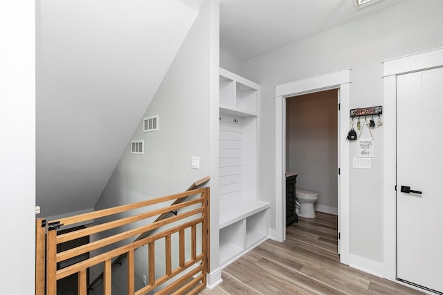 16318 Goldenrod Dr, Urbandale, IA 50323 - bathroom with toilet, wood finished floors, baseboards, and visible vents