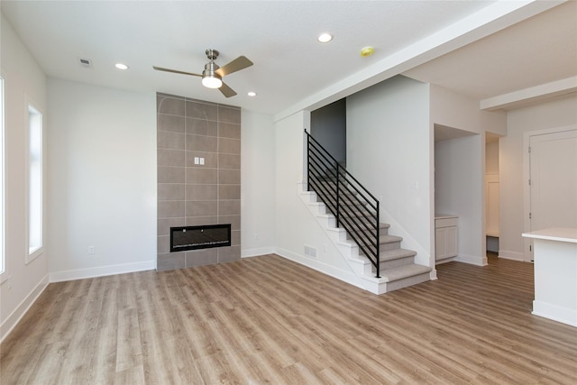 unfurnished living room with light wood-style flooring, visible vents, ceiling fan, and recessed lighting