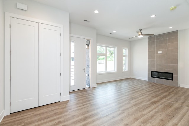 unfurnished living room with visible vents, baseboards, a ceiling fan, and recessed lighting