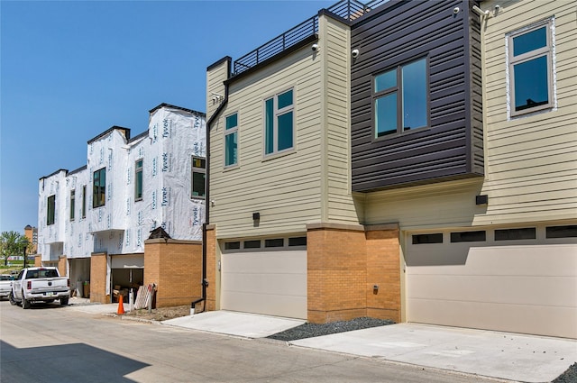 exterior space featuring a garage and concrete driveway
