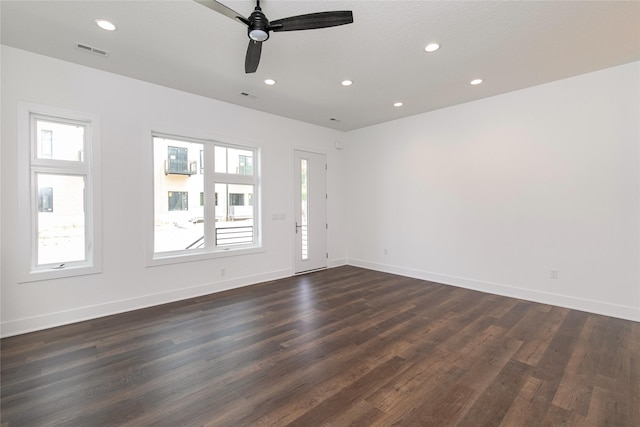 unfurnished room with visible vents, baseboards, ceiling fan, dark wood finished floors, and recessed lighting