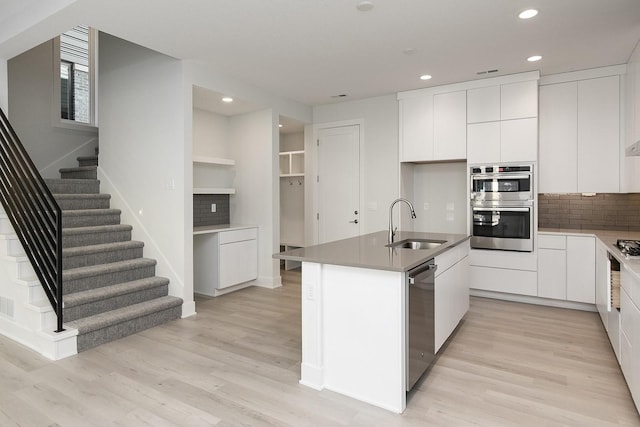 213 Maple St, Des Moines, IA 50309 - kitchen featuring light wood-style flooring, appliances with stainless steel finishes, a sink, and recessed lighting
