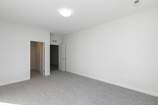 213 Maple St, Des Moines, IA 50309 - carpeted spare room with baseboards and visible vents