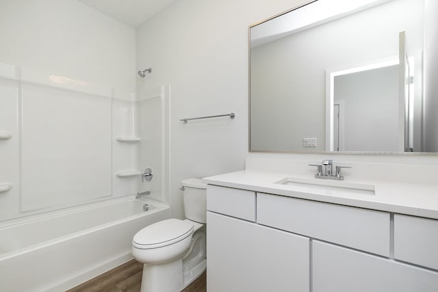 209 Maple St, Des Moines, IA 50309 - full bathroom with toilet, shower / washtub combination, vanity, and wood finished floors