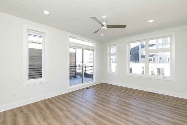 209 Maple St, Des Moines, IA 50309 - empty room with wood finished floors, baseboards, a ceiling fan, and recessed lighting