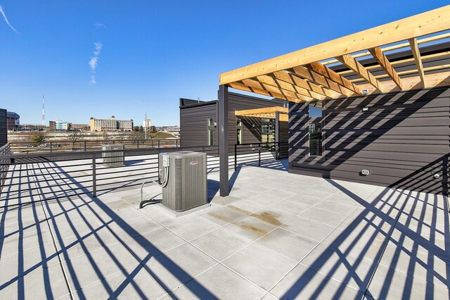 209 Maple St, Des Moines, IA 50309 - view of patio / terrace featuring central air condition unit, a pergola, and a view of city