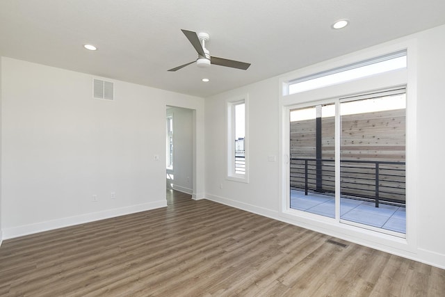 209 Maple St, Des Moines, IA 50309 - empty room featuring visible vents, ceiling fan, wood finished floors, and baseboards