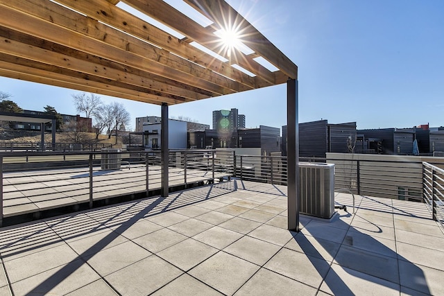 209 Maple St, Des Moines, IA 50309 - view of patio featuring a pergola and central AC unit