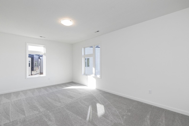 205 Maple St, Des Moines, IA 50309 - carpeted empty room featuring visible vents and baseboards