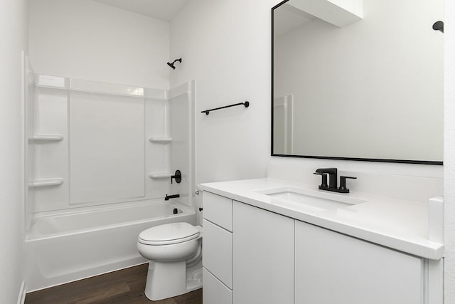 205 Maple St, Des Moines, IA 50309 - bathroom featuring toilet, vanity, wood finished floors, and shower / bathtub combination