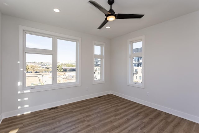 859 E 2nd St, Des Moines, IA 50309 - unfurnished room featuring dark wood-style flooring, baseboards, recessed lighting, visible vents, and ceiling fan
