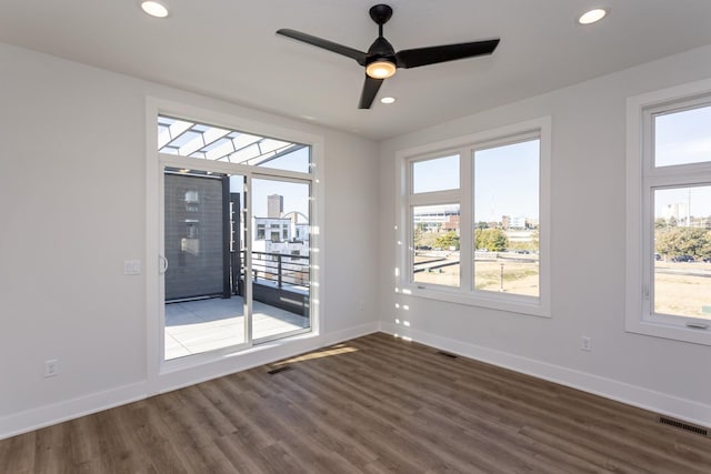 859 E 2nd St, Des Moines, IA 50309 - unfurnished room featuring dark wood-style flooring, visible vents, baseboards, and recessed lighting