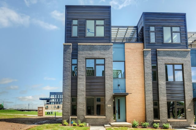 contemporary house with brick siding