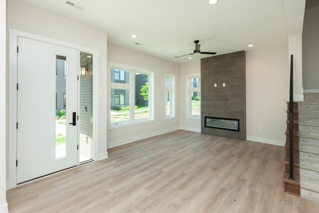 unfurnished living room with a ceiling fan, visible vents, recessed lighting, light wood finished floors, and baseboards