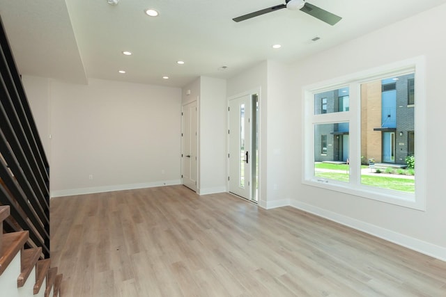 unfurnished living room featuring light wood-style floors, ceiling fan, baseboards, and recessed lighting