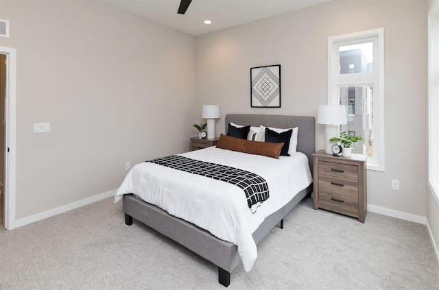 820 E 2nd St, Des Moines, IA 50309 - bedroom featuring visible vents, baseboards, a ceiling fan, and light colored carpet