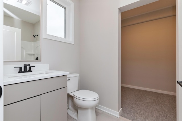820 E 2nd St, Des Moines, IA 50309 - full bath with visible vents, baseboards, walk in shower, toilet, and vanity