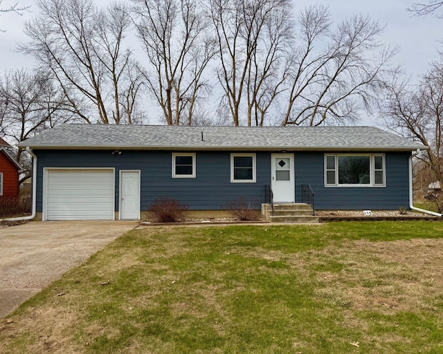 ranch-style house with an attached garage, driveway, and a front yard