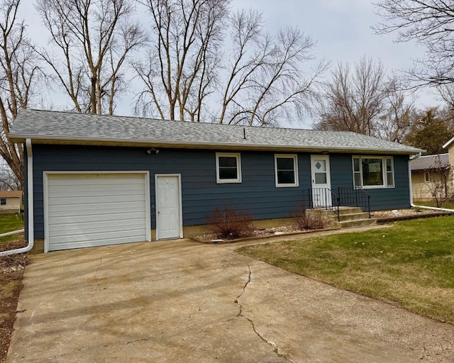 single story home featuring driveway, a garage, and a front lawn