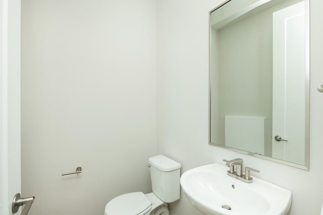 822 E 2nd St, Des Moines, IA 50309 - half bathroom with toilet and a sink