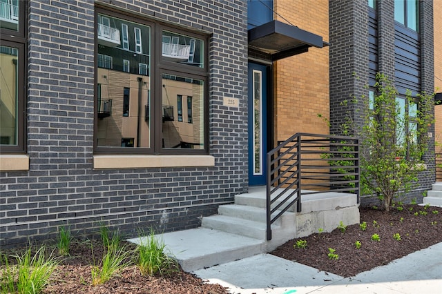 225 Maple St, Des Moines, IA 50309 - doorway to property featuring brick siding