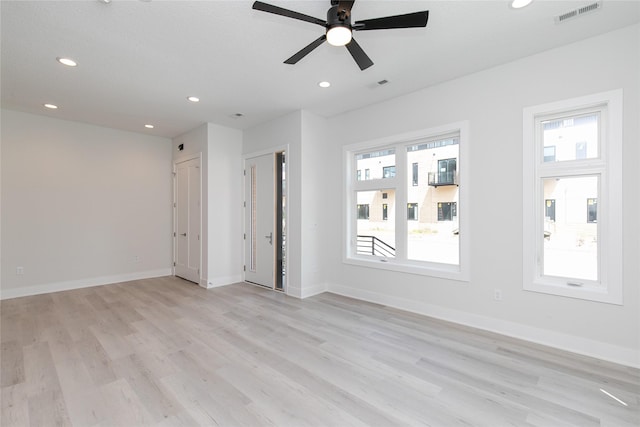 225 Maple St, Des Moines, IA 50309 - empty room featuring visible vents, recessed lighting, plenty of natural light, and light wood-style floors