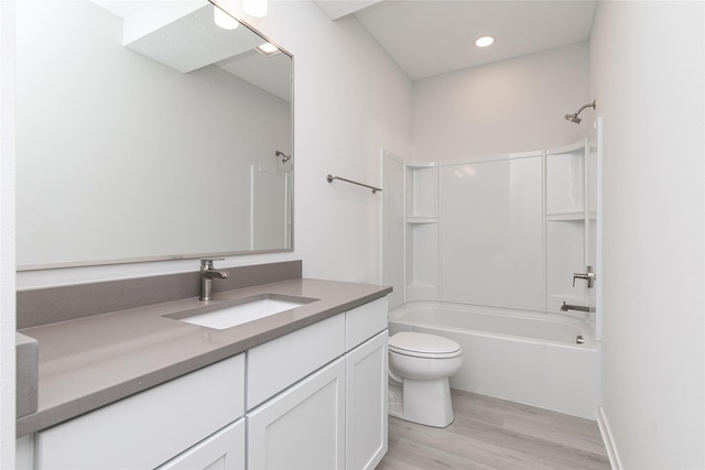 225 Maple St, Des Moines, IA 50309 - bathroom featuring vanity, recessed lighting, bathing tub / shower combination, toilet, and wood finished floors