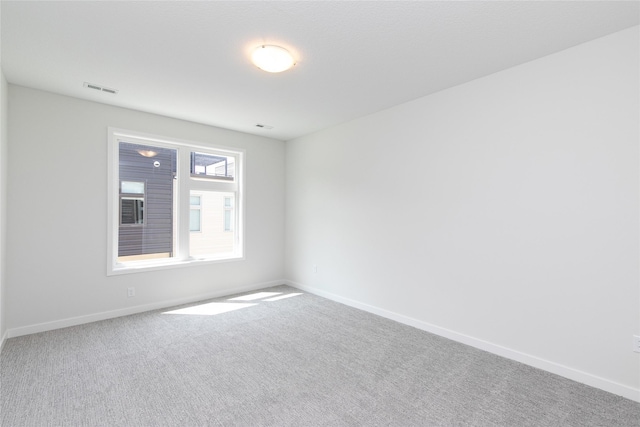 225 Maple St, Des Moines, IA 50309 - carpeted spare room with visible vents and baseboards