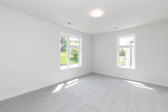 225 Maple St, Des Moines, IA 50309 - empty room with carpet flooring and baseboards