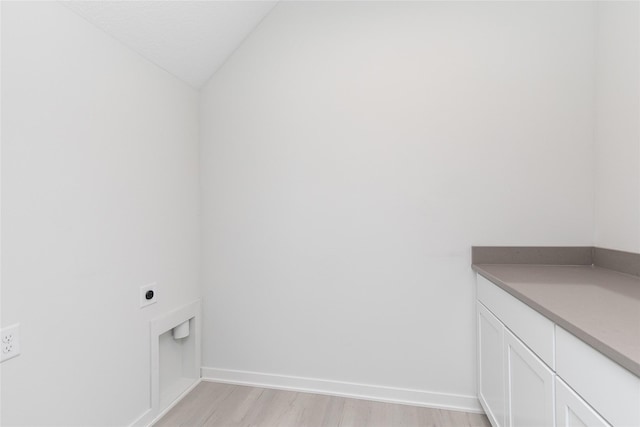 225 Maple St, Des Moines, IA 50309 - laundry room featuring cabinet space, light wood finished floors, baseboards, and hookup for an electric dryer